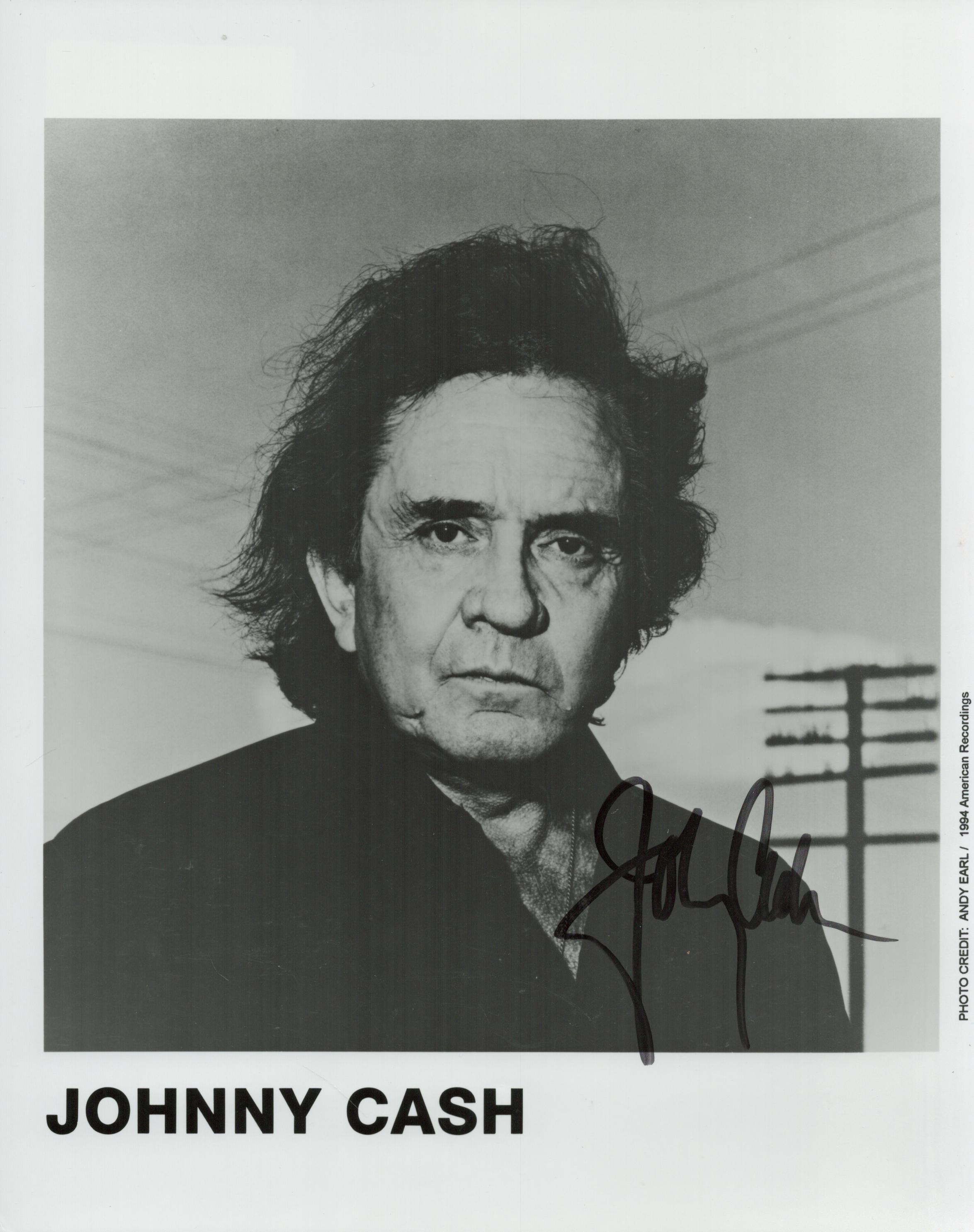 Johnny Cash signed 10x8 inch black and white promo photo. Good condition. All autographs are genuine