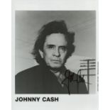 Johnny Cash signed 10x8 inch black and white promo photo. Good condition. All autographs are genuine