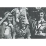 Jimmy Greenhoff and Alex Stepney signed 12x8 inch black and white photo pictured celebrating after