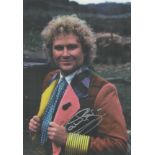 Colin Baker signed 12x8 inch Doctor Who colour photo. Good condition. All autographs are genuine