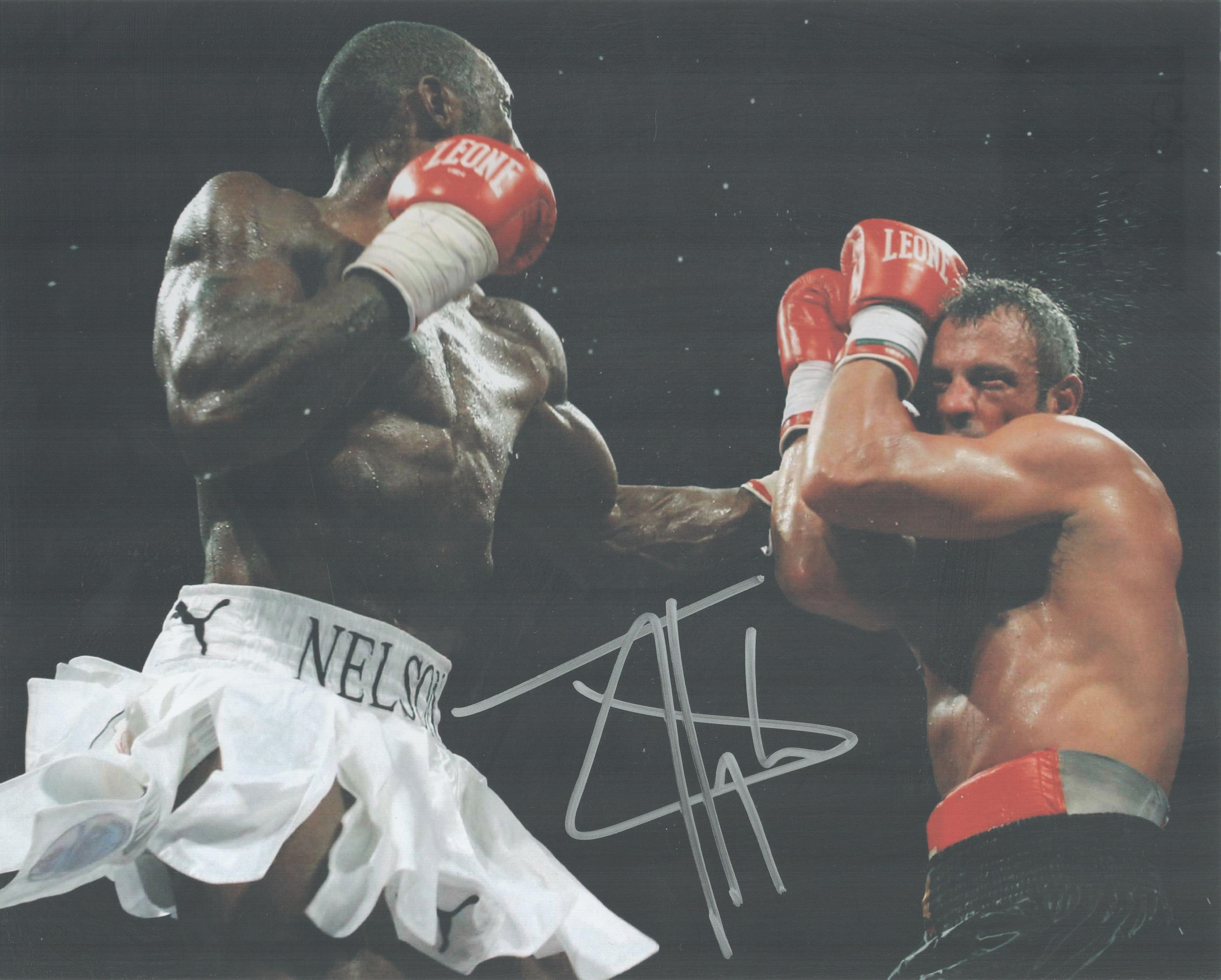 Boxing Star Johnny Nelson Signed 10x8 inch Colour In Action Photo. Good condition. All autographs