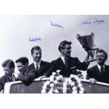 Football Autographed Tottenham 16 X 12 Photo : B/W, Depicting Tottenham's Ron Henry Holding The