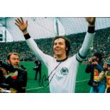 Franz Beckenbauer signed 12x8 inch colour photo pictured celebrating after the 1974 World Cup final.
