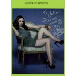 Danielle Bisutti signed colour photo. Dedicated. An American Actress. On an A4 Green sheet photo