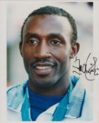 Linford Christie signed 10x8 inch colour photo. Good condition. All autographs are genuine hand