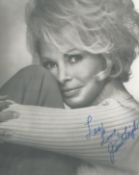 Janet Leigh signed 10x8 inch black and white photo. Good condition. All autographs are genuine