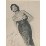 Shirley Bassey signed 9x7 inch original black and white photo dedicated. Good condition. All