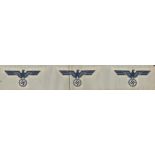 A strip of silk 14" x 2¼" having 3 spreadeagles with swastika below held in eagle claws. Produced in