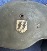 WW2 German Helmet with One SS Emblem still has Lining and Chin strap, good condition. Good