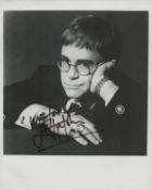 Elton John signed 10x8 black and white photo. Good condition. All autographs are genuine hand signed
