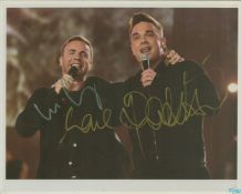 Gary Barlow and Robbie Williams signed 10x8 colour photo. Good condition. All autographs are genuine