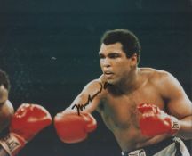 Muhammad Ali signed colour photo. Boxer and Activist. 10x8 Inch. Good condition. All autographs