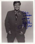 Elton John signed 10x8 inch black and white photo dedicated. Good condition. All autographs are