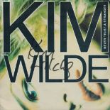 Kim Wilde, a vinyl 7" single of Never Trust a Stranger (1988). Signed to the front cover. Label