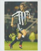 Football Jonathan Woodgate signed 10x8 inch colour photo pictured in action for Newcastle United.