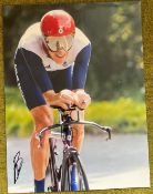 Cycling Bradley Wiggins signed 16 x 12 inch colour action photo. Good condition. All autographs