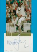 Cricket. Mervin Hughes Signed Autograph Card with Colour Glossy Photo Attached to Blue Card.