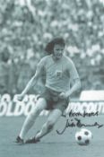 Football Mick Channon signed 12x8 inch black and white photo pictured in action for England. Good