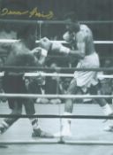 Boxing Dennis Andries signed 16x12 inch black and white photo pictured during his fight with