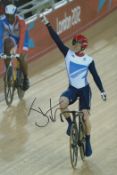 Olympics. Jason Kenny Signed 12 x 8 inch Colour Photo Showing Kenny Cycling at London 2012. Good
