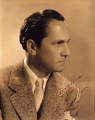 Frederic March, a signed and dedicated 9x7 vintage photo. He was an American actor, regarded as