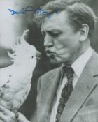 David Attenborough signed 10x8inch black and white photo with a parakeet. Good condition. All