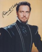 Richard Todd signed 10x8 inch colour photo. Good condition. All autographs are genuine hand signed