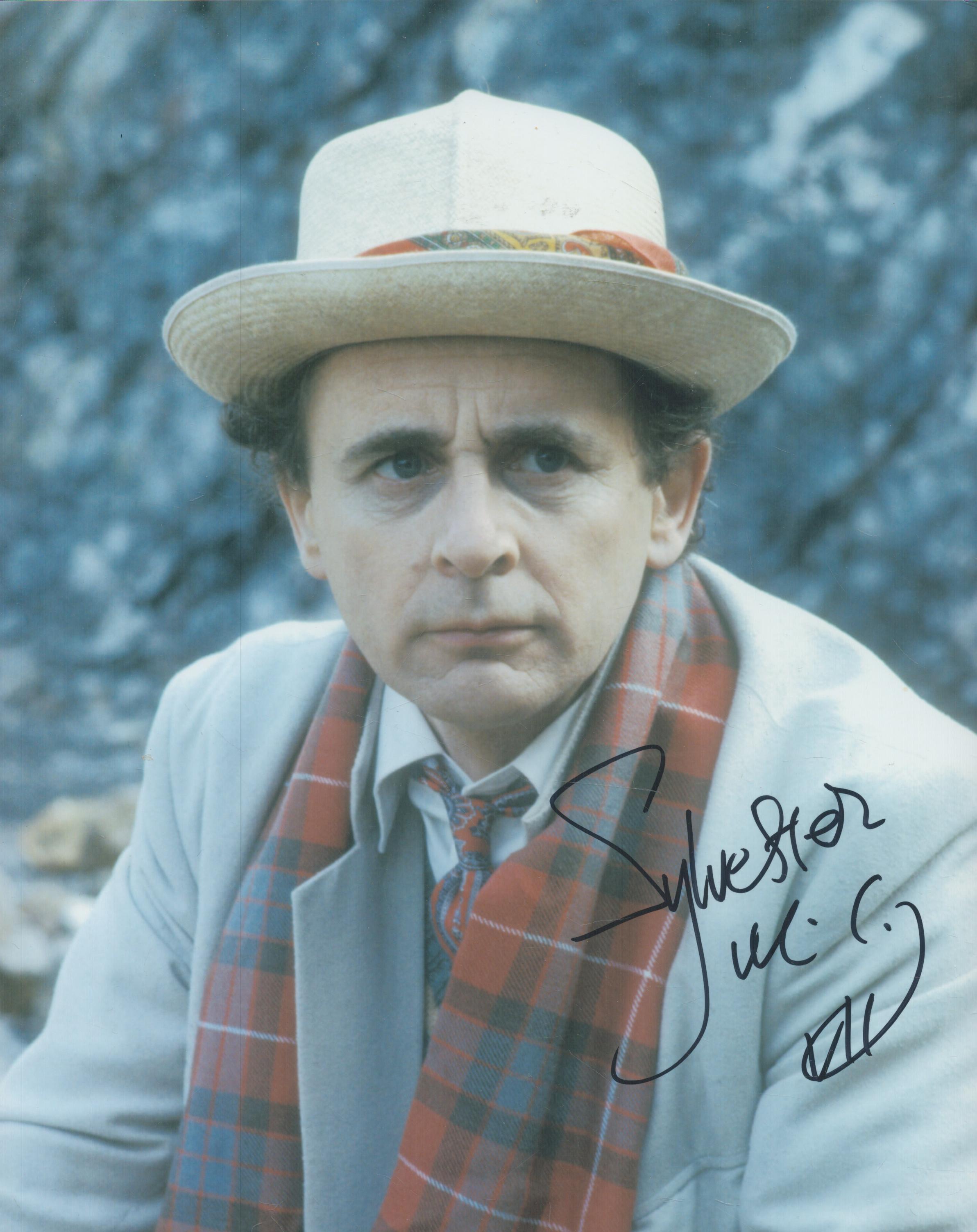 Sylvester McCoy signed 10x8 inch colour photo pictured during his time as DR WHO. Good condition.