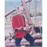 Michael Caine signed 10x8 inch colour photo pictured in role in iconic film ZULU. Good condition.