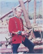 Michael Caine signed 10x8 inch colour photo pictured in role in iconic film ZULU. Good condition.