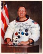 John L. Swigert signed 10x8 inch original NASA colour photo pictured in space suit dedicated. From