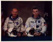Thomas P. Stafford and Gene Cernan signed 10x8 inch colour photo pictured in space suit sitting