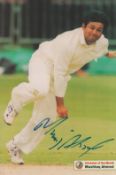 Cricket Mushtaq Ahmed signed 12x8 inch colour magazine photo. Good condition. All autographs are