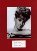 Angela Douglas signed Black & White Photo an actress. Mount 16 x 12 Inch. Good condition. All