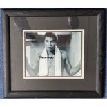 Muhammad Ali signed 17x15 inch overall mounted and framed vintage black and white photo. Good