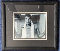 Muhammad Ali signed 17x15 inch overall mounted and framed vintage black and white photo. Good