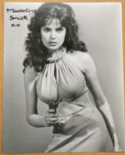 James Bond actress Madeline Smith signed sexy 10 x 8 b/w portrait photo pointing a gun. She is