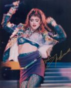 Madonna signed 10x8 inch colour photo. Good condition. All autographs are genuine hand signed and