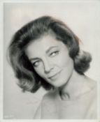 Lauren Bacall signed 10x8 inch original black and white photo pictured from the film The Moving