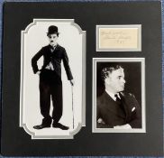 Charlie Chaplin 13x13 inch overall mounted signature piece includes signed album page dated 1933 and
