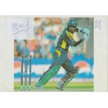 Mohammad Yousuf signed Autograph cut out Approx. 3x2.25 Inch fixed onto a colour photo 11.75x8.25