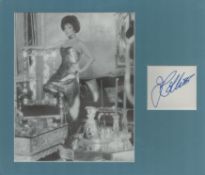 Joan Collins signed signature piece 2.95x2.5 Inch plus black and white photo 8.5x6.95 Mounted Inch