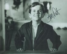 The Munsters actor Butch Patrick signed young 10 x 8 inch b/w photo smiling in casual clothes.