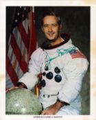 James A. McDivitt signed NASA original 10x8 inch colour photo pictured in space suit. From single.