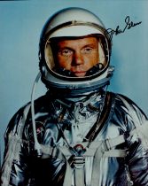 John Glenn signed 10x8inch colour spacesuit photo. Good condition. All autographs are genuine hand