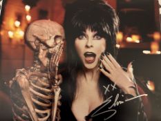 Elvira Mistress of the Dark signed stunning 14x11 inch photo. Good condition. All autographs are