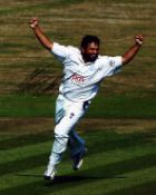 Cricket Mushtaq Ahmed signed 10x8 inch colour photo pictured in action for Sussex. Good condition.