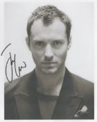 Jude Law signed 8x6inch black and white photo. Good condition. All autographs are genuine hand