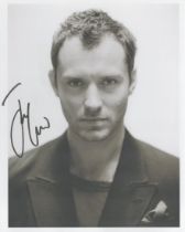 Jude Law signed 8x6inch black and white photo. Good condition. All autographs are genuine hand
