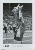 Norman Whiteside (Man Utd) signed 16.5 x 12 inch black and white print. Signed in black ink. Good
